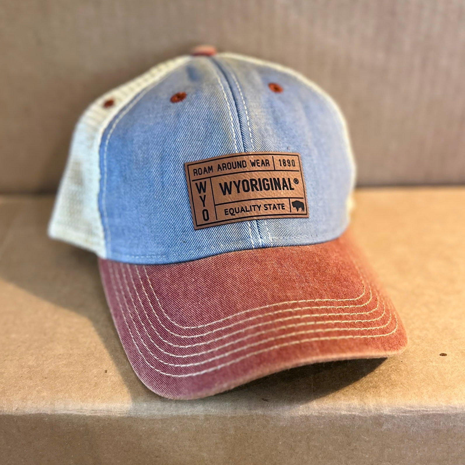 WYORIGINAL leather patch hat on tri-color dad hat. Legacy fit. Old favorite hat. Roam Around Wear is a Wyoming t-shirt company based out of Gillette, Wyoming