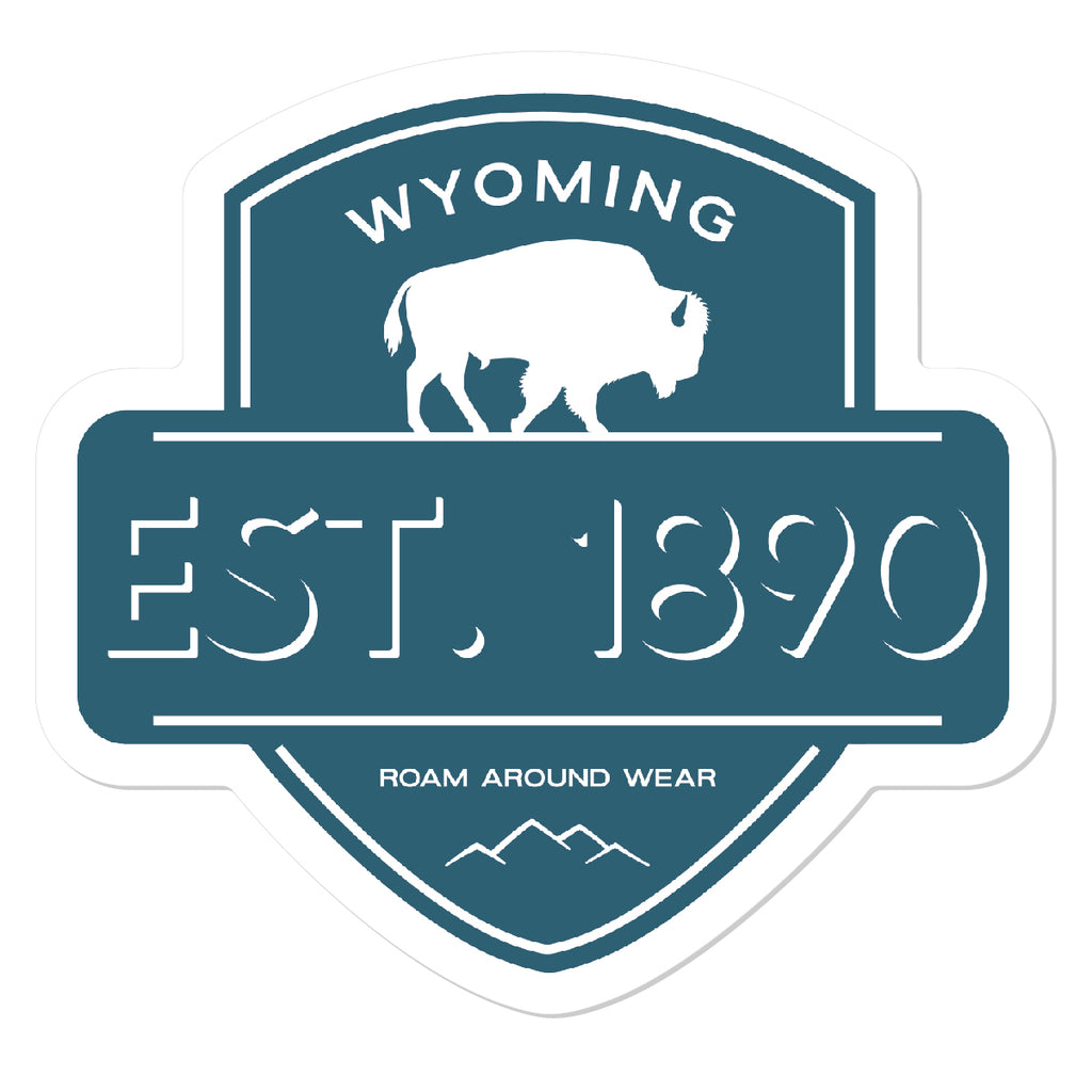 Turqoise blue and white  1890 badge sticker. 3" waterproof and weatherproof sticker. Roam Around Wear is a women owned Wyoming T-Shirt company based out of Gillette, Wyoming.