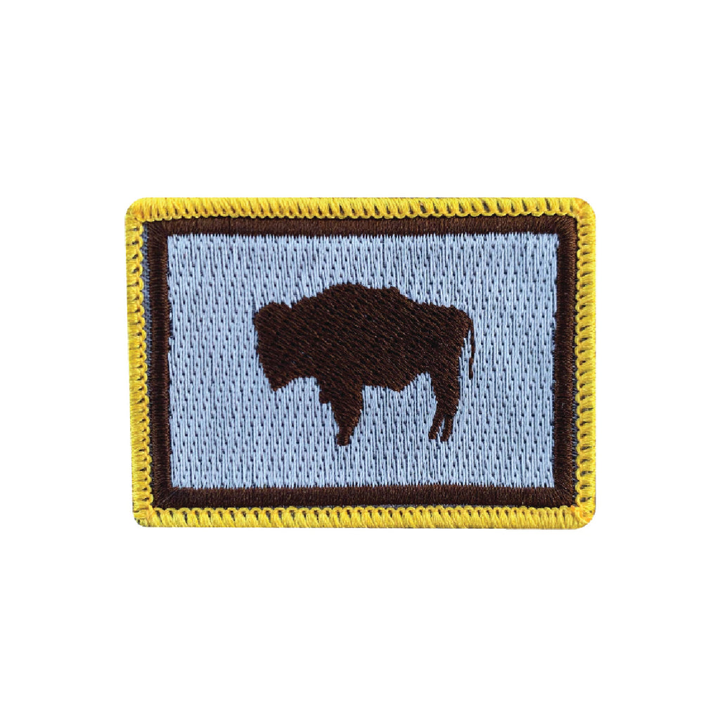 Brown, gold and gray embroidered flag patch. Roam Around Wear is a women owned Wyoming T-Shirt company based out of Gillette, Wyoming.